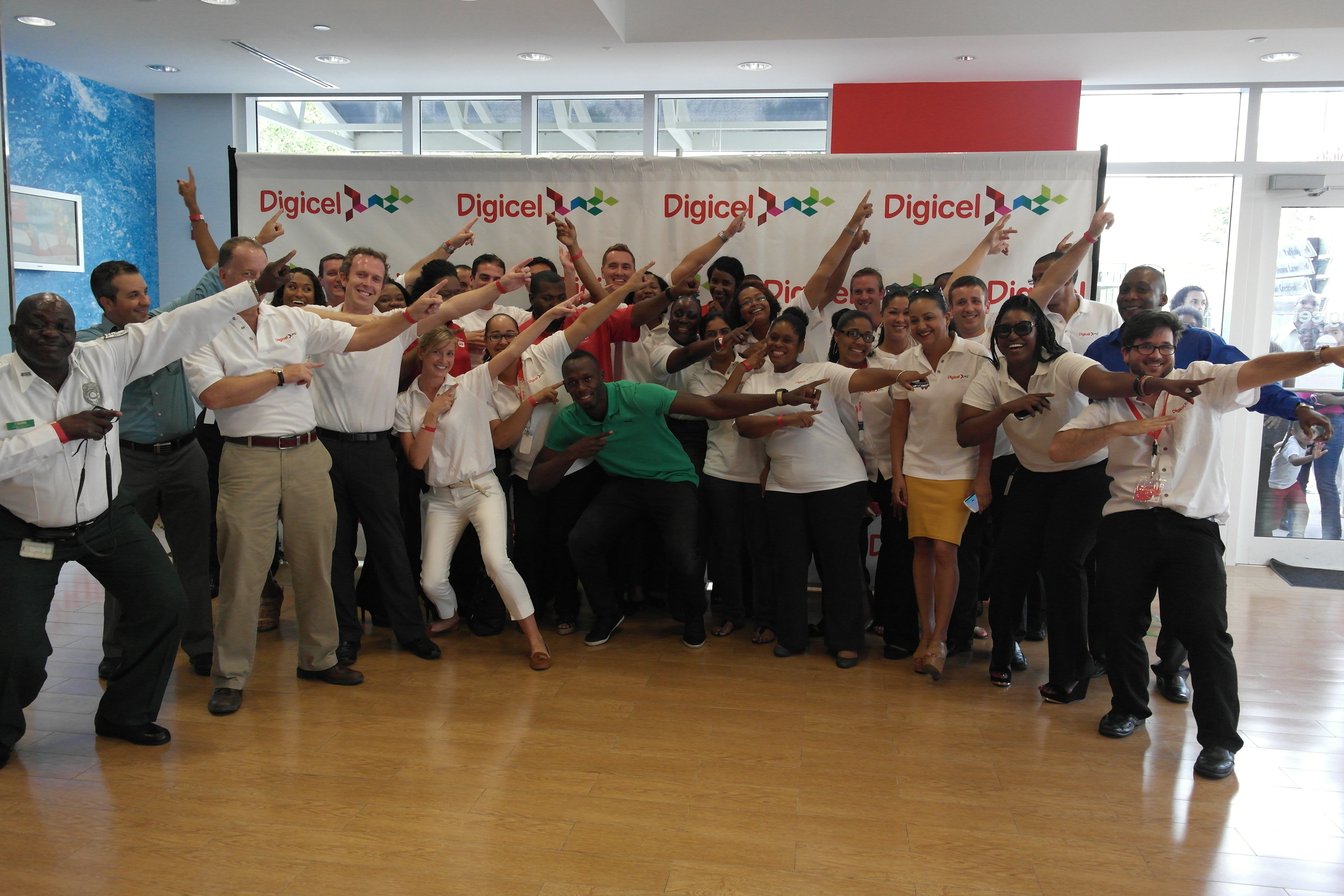 Usain meets the Digicel staff in Gran Cayman